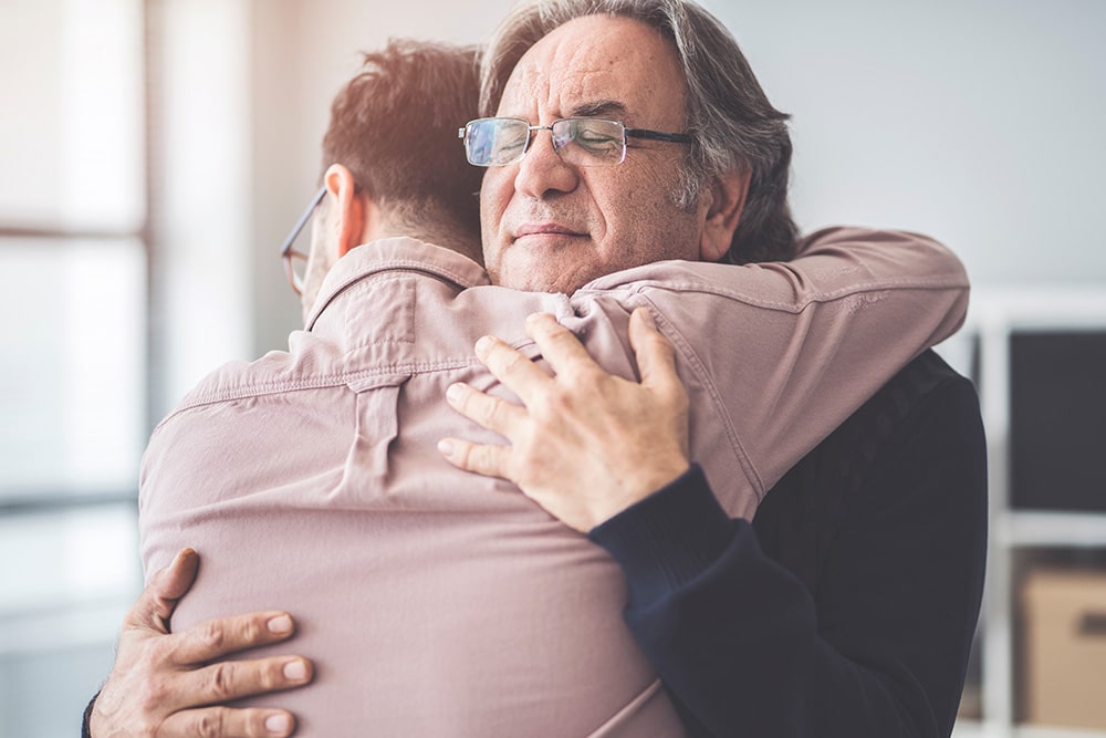suboxone clinic offers drug treatment program for opioid abuse father and son hugging